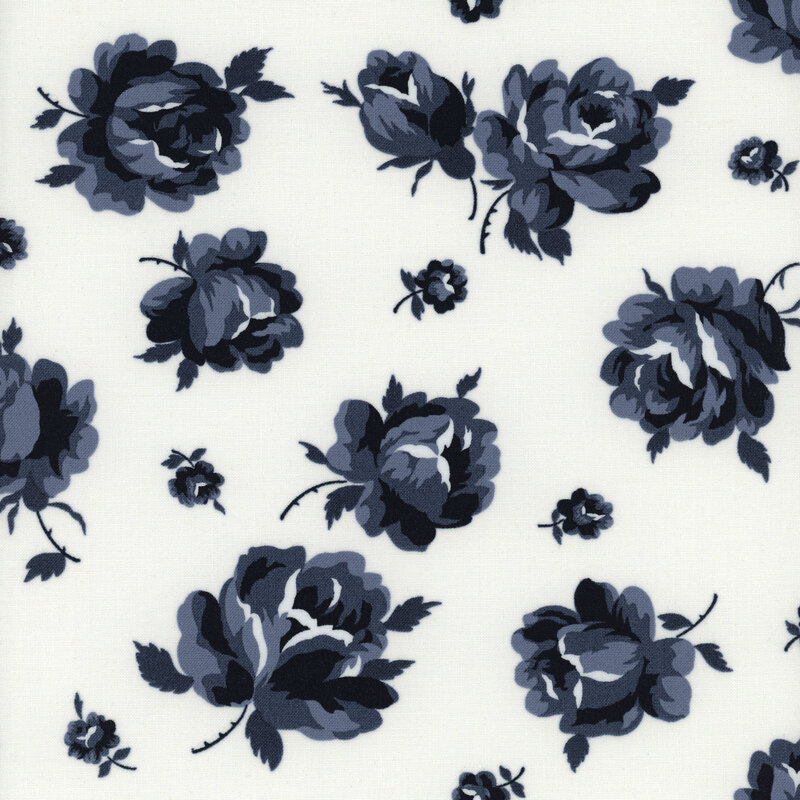 Fabric featuring large navy blue roses with smaller buds on a white background.