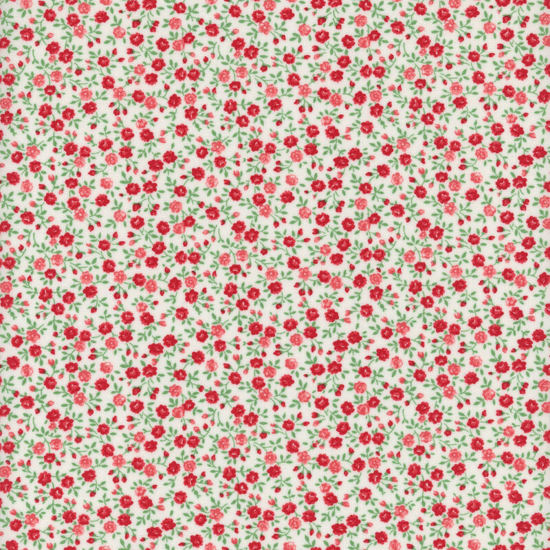 A repeating pattern of small red and pink roses on a white background, with green leaves.