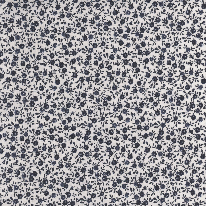 A repeating pattern of small navy blue roses on a white background.