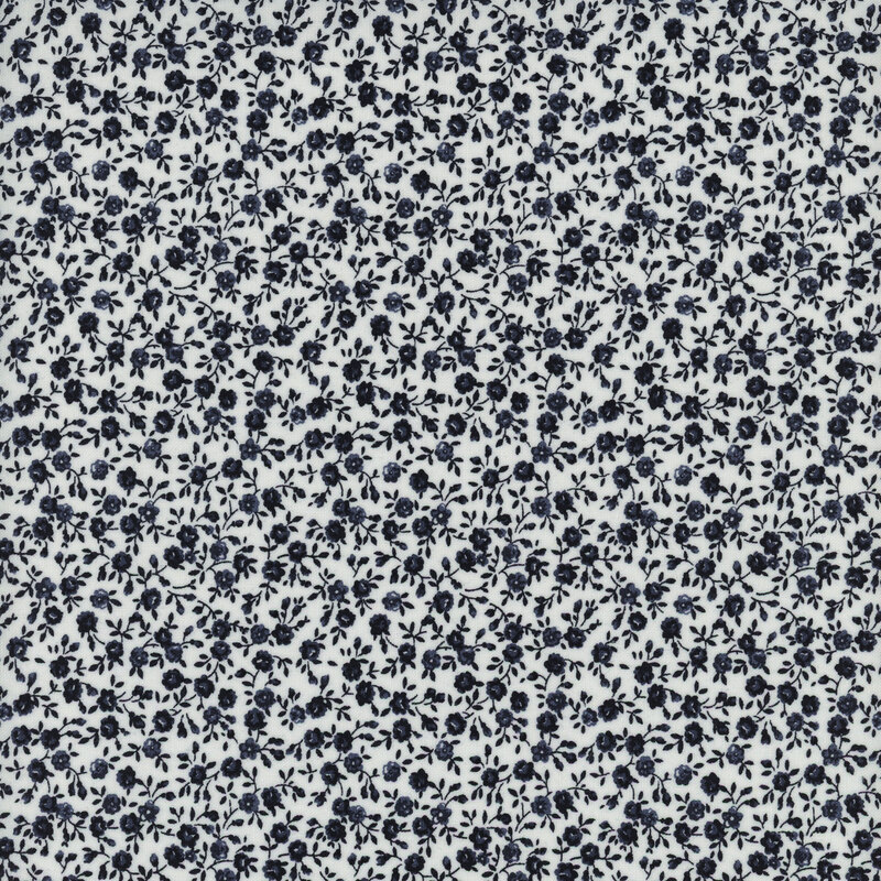 A repeating pattern of small navy blue roses on a white background.