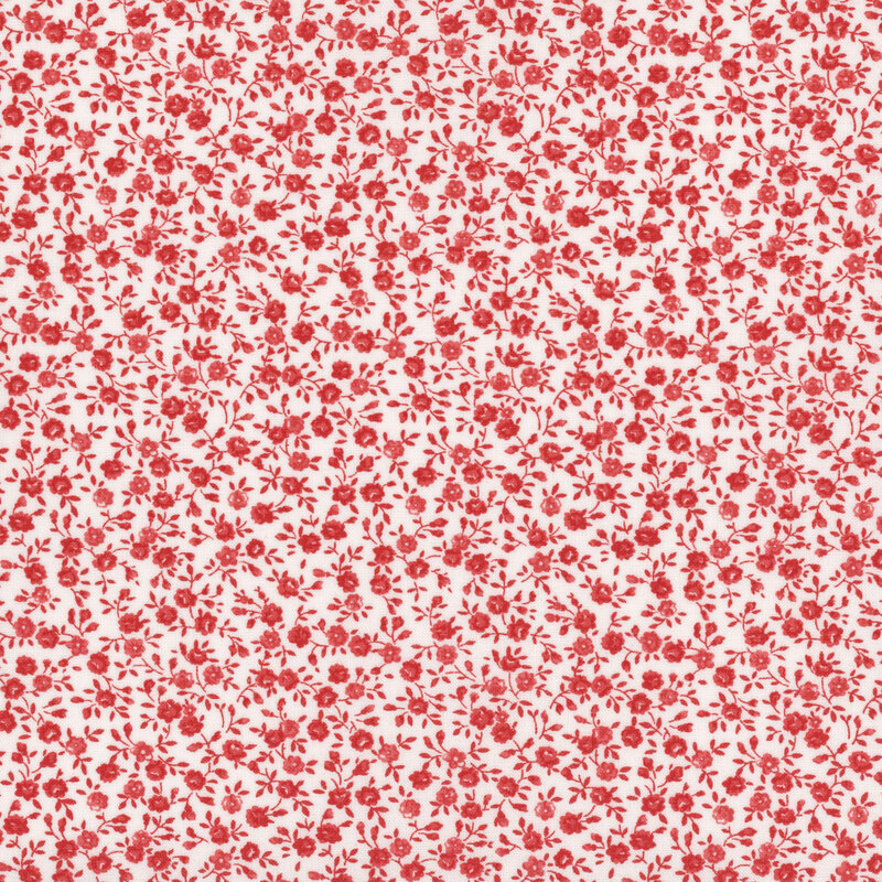 A repeating pattern of small red roses on a white background.