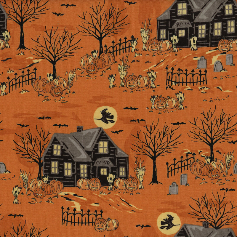 Orange fabric with a Halloween-themed neighborhood design with witches flying across the silhouette of the moon.