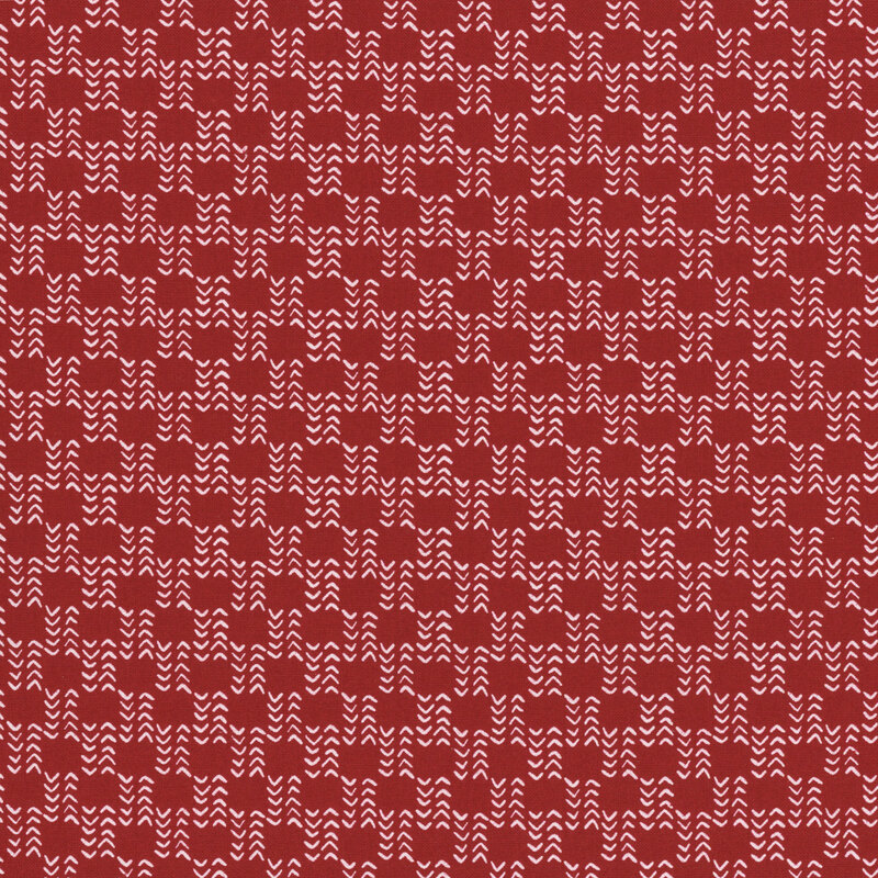 Red fabric pattern featuring white wavy lines in a repetitive design.