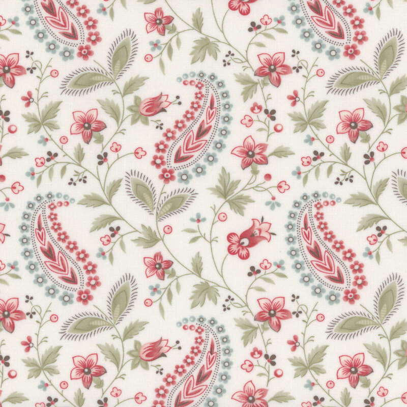 Floral paisley pattern in red, pink, and green on a light cream background.