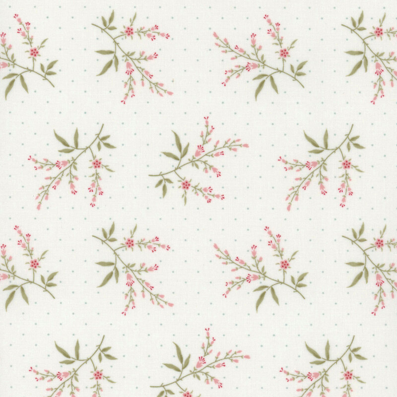 Floral fabric featuring delicate pink blossoms and green leaves on a light, dotted background.