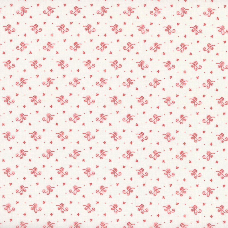 Repeating pattern of red calico florals on a light cream fabric.