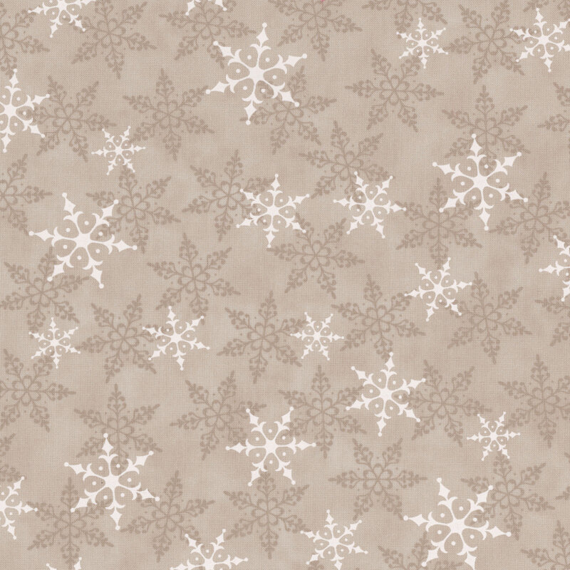 Warm gray fabric with white and tonal snowflakes tossed across the design.