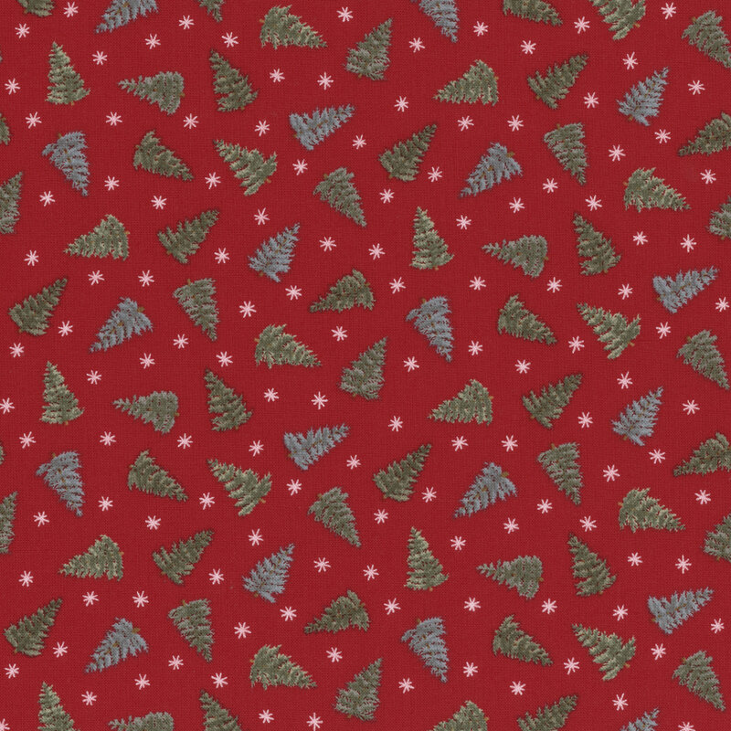 Berry red fabric with tossed trees and simplified stars.