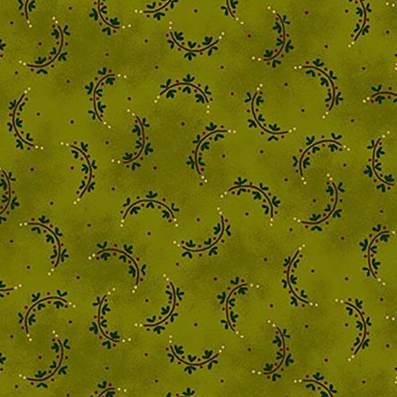 Green fabric with a repeating pattern of curved vines and small dots.