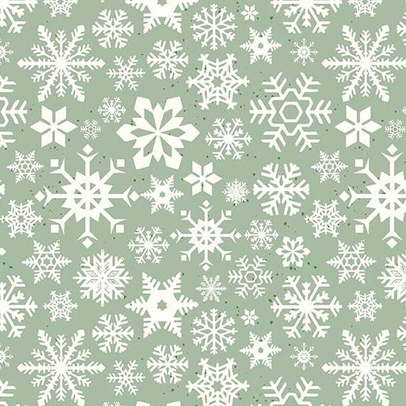 White snowflakes of various designs on a muted green background.