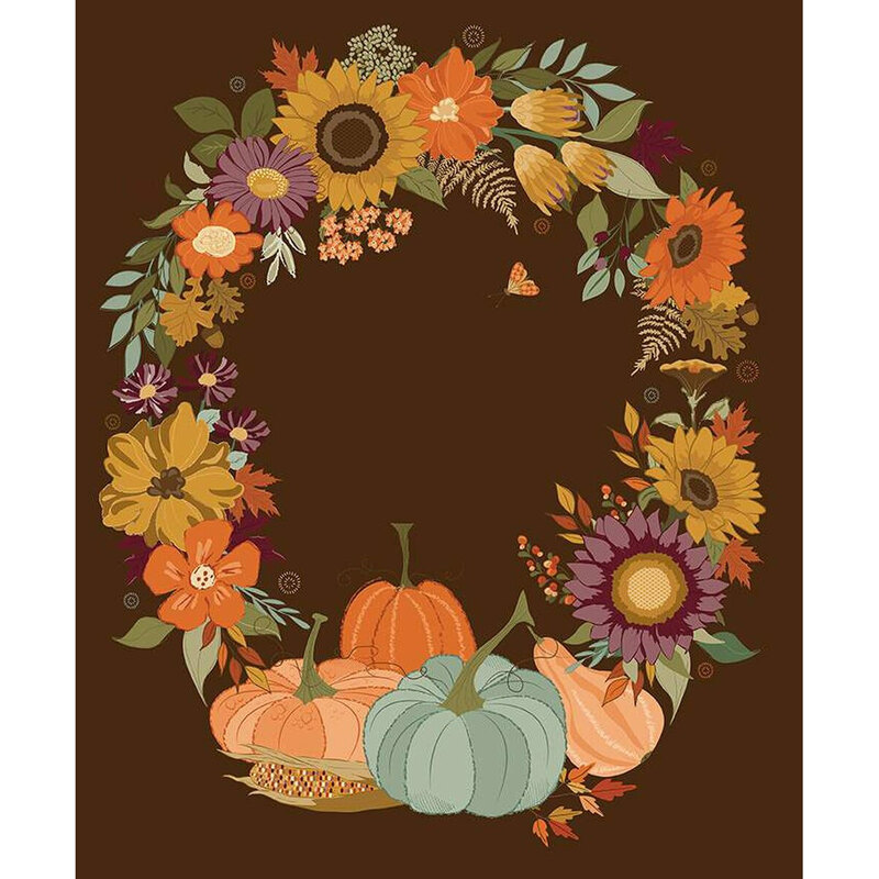 Fabric panel with a wreath of colorful flowers and pumpkins on a dark brown background.