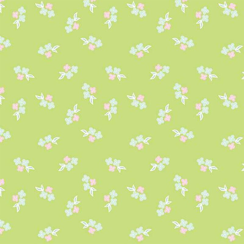 Bright green fabric with a calico pattern of pink and blue florals