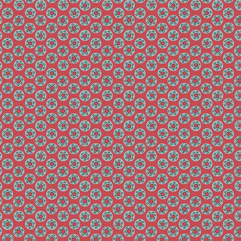 Red fabric with a repeating pattern of blue circles and red center, creating a playful design.