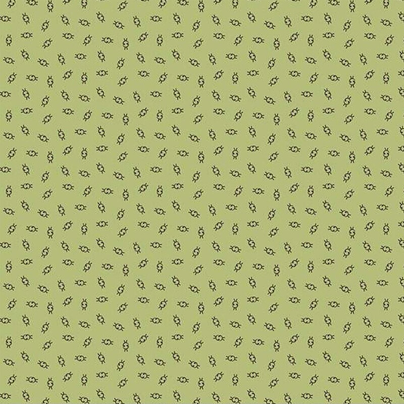 Fabric with a green background featuring small, repeated ditsy illustrations.