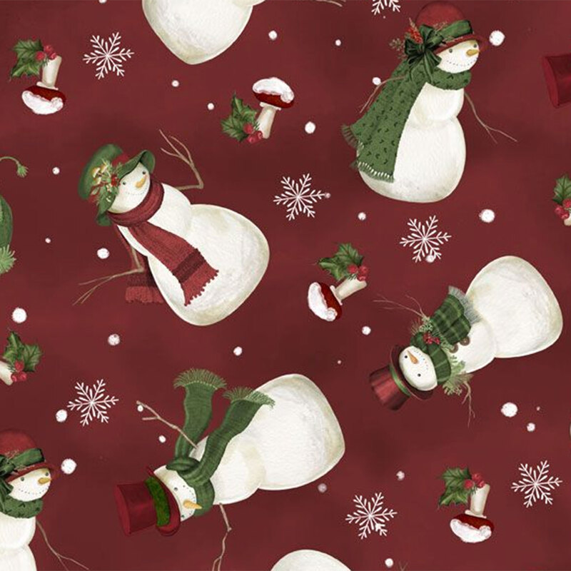 A fabric pattern featuring snowmen in hats and scarves, snowflakes, and holiday decorations on a red background.