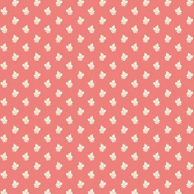 Coral pink fabric with white and buttercream three-petal flowers.