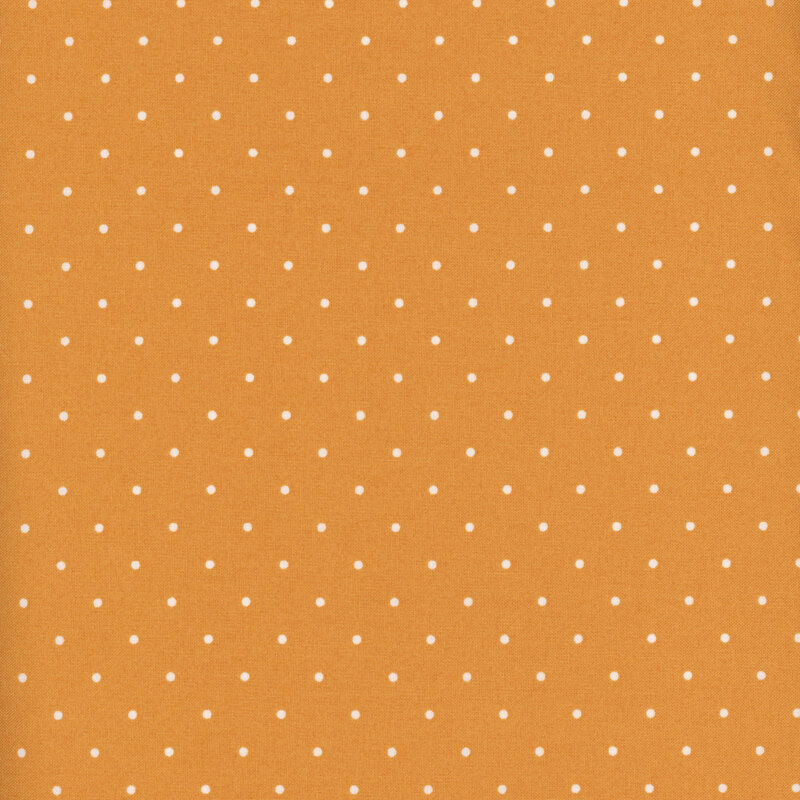 Golden yellow fabric with white polka dots.