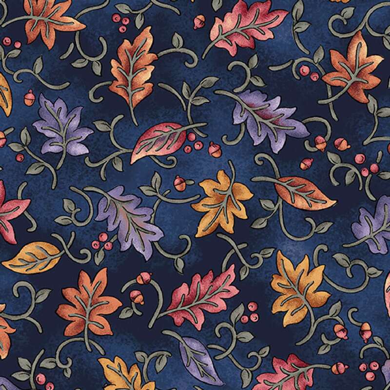 A rich blue fabric featuring a decorative pattern of colorful autumn leaves and swirls.