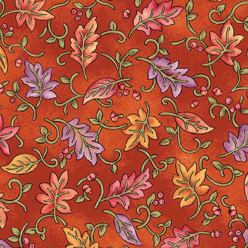 A rich orange fabric featuring a decorative pattern of colorful autumn leaves and swirls.