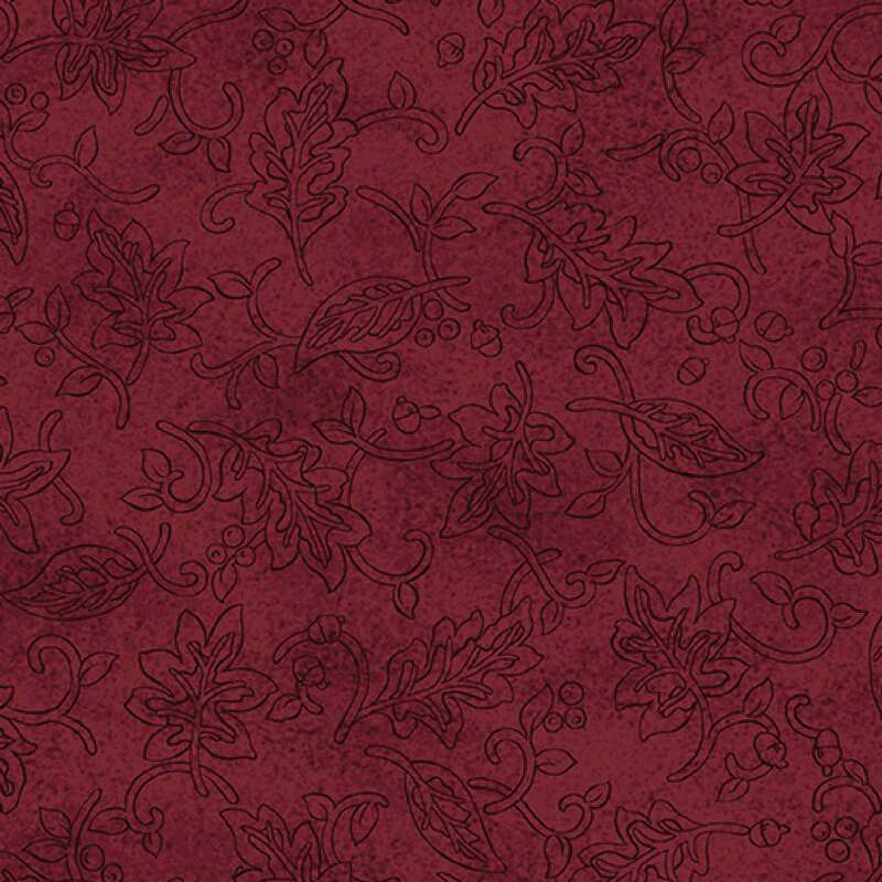 Textured burgundy fabric featuring subtle floral and leaf patterns.