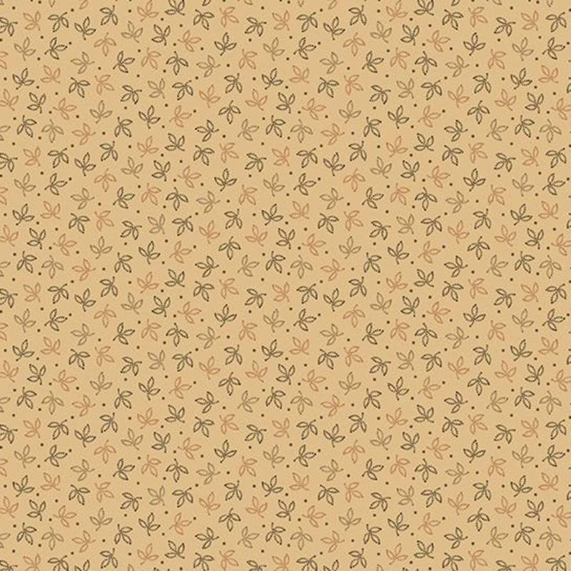 Rich cream fabric with small orange, brown, and beige leaves with brown polka dots.