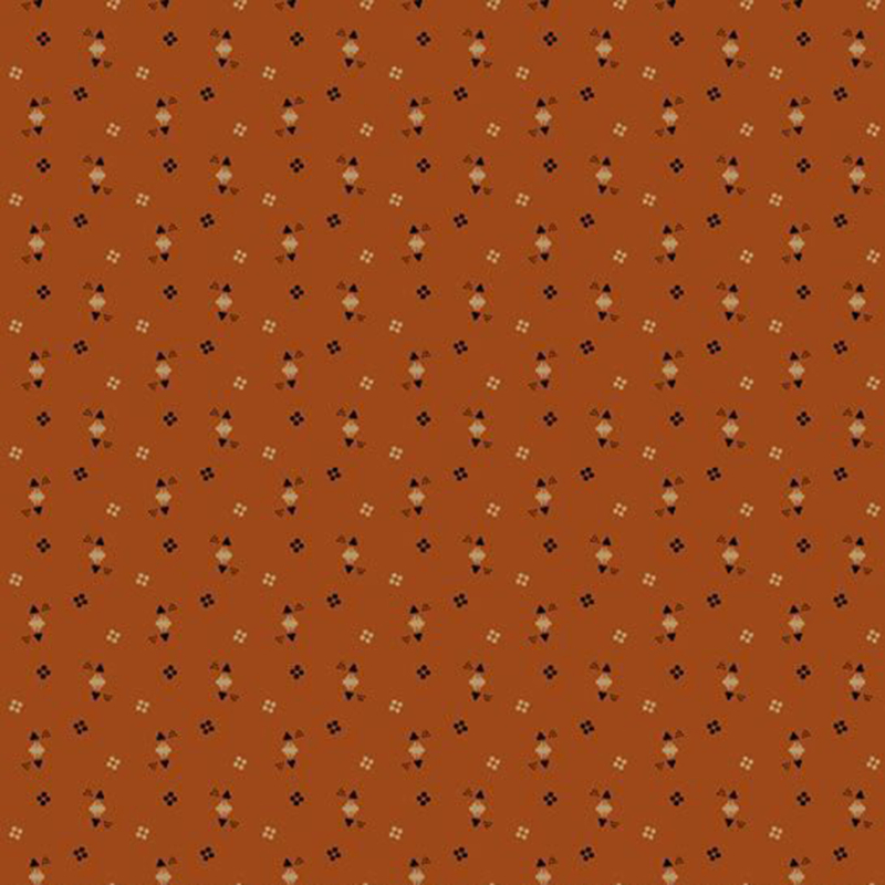 Burnt orange fabric with a tossed geometric pattern of circles, triangles, and squares in tonal brown, cream, and black