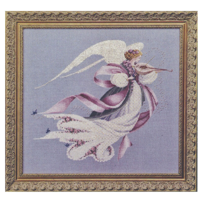 The completed Angel of Spring cross stitch hung in an ornate wooden frame.