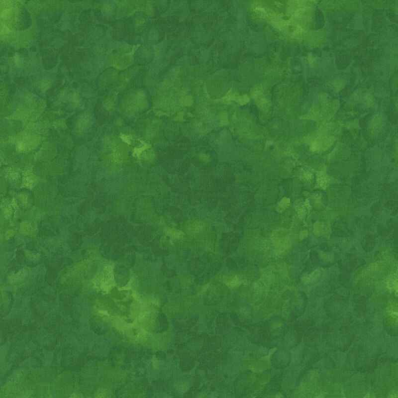 Abstract green fabric with varying shades, resembling a watercolor or marbled effect.