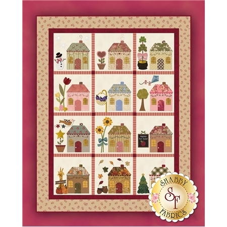 A 12 block applique BOM with rows of monthly themed cottages.