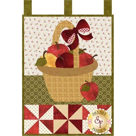 Applique red, yellow, and green apples in a tan basket with a red gingham bow.