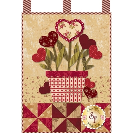 Bouquet of heart-shaped blossoms emerging from a red and white plant pot.