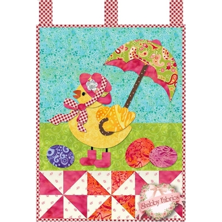 Easter chick in a pink floral hat and rain boots holding an umbrella