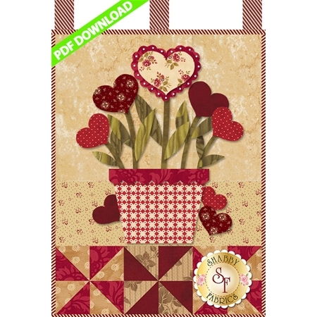 Bouquet of heart-shaped blossoms emerging from a red and white plant pot.