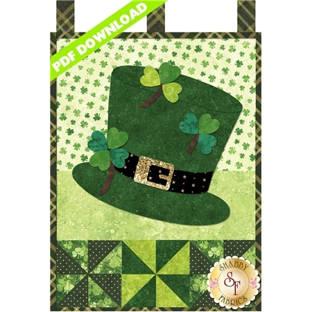 Green top hat with black belt and sparkly gold buckle. It's decorated with three green shamrocks.