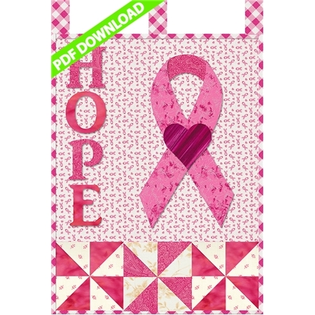 Pink applique letters reading HOPE beside a pink awareness ribbon for breast cancer.