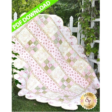 Pastel quilt with pink 9-patch blocks, ivory blocks, and scalloped borders.