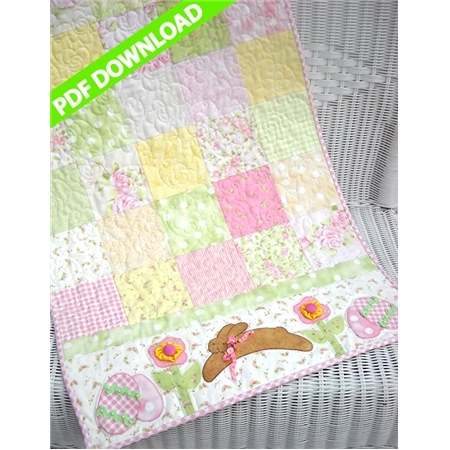 Pink and green pastel patchwork table runner with a brown bounding bunny applique.