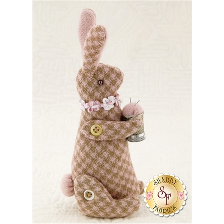 Bitty Bunny Pincushion Pattern cover featuring the finished stuffed bunny pincushion.