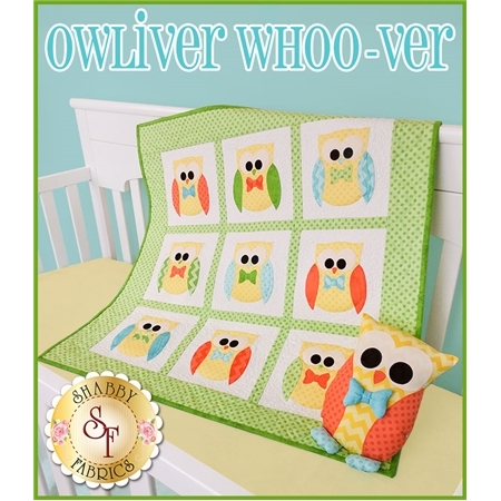 Owliver quilt with nine blocks featuring a yellow owl with a bow tie and matching pillow.