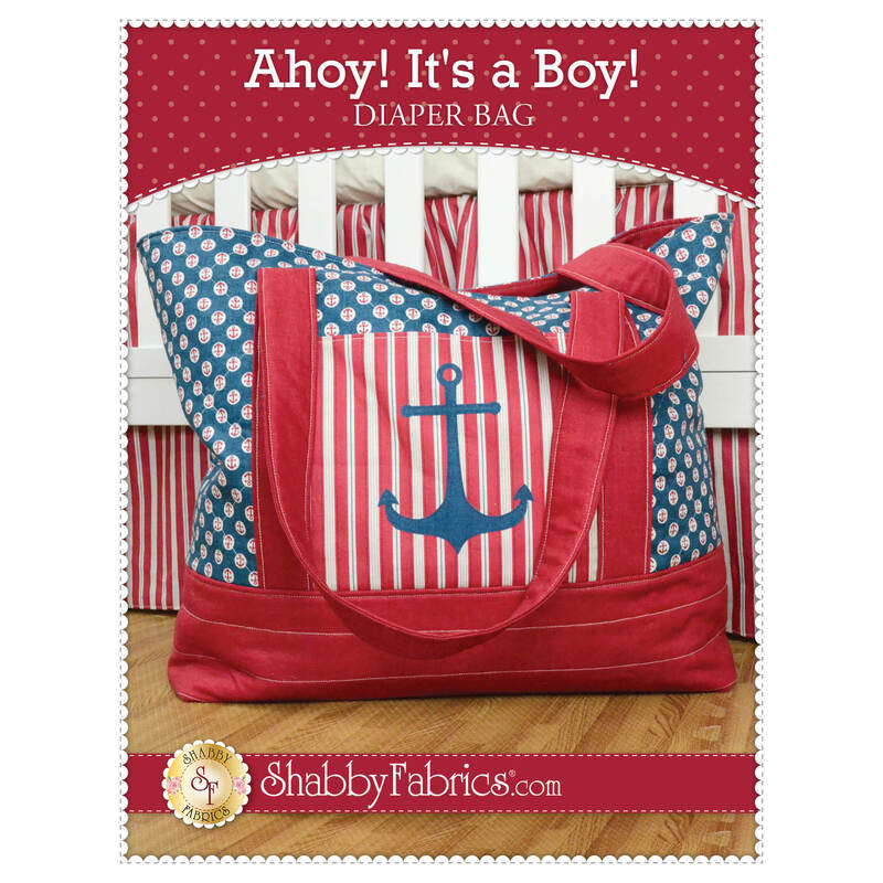 The front of the Ahoy! It's a Boy! Diaper Bag pattern by Shabby Fabrics showing the finished bag with a blue anchor on the front pocket.