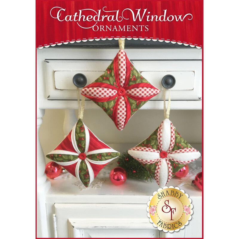 Three red and green quilted ornaments in the Cathedral Window style with red central buttons.