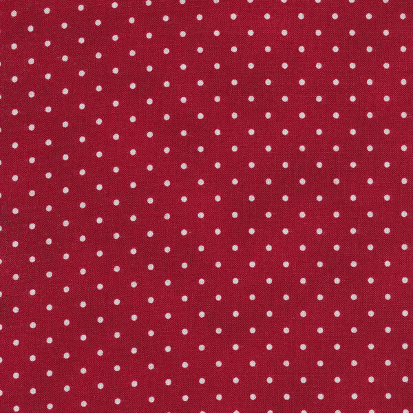 Fabric features tiny cream polka dots on mottled crimson red | Shabby Fabrics