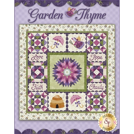 Purple and green garden themed patchwork quilt. Embroidered blocks read Love, Hope, Faith, Charity.