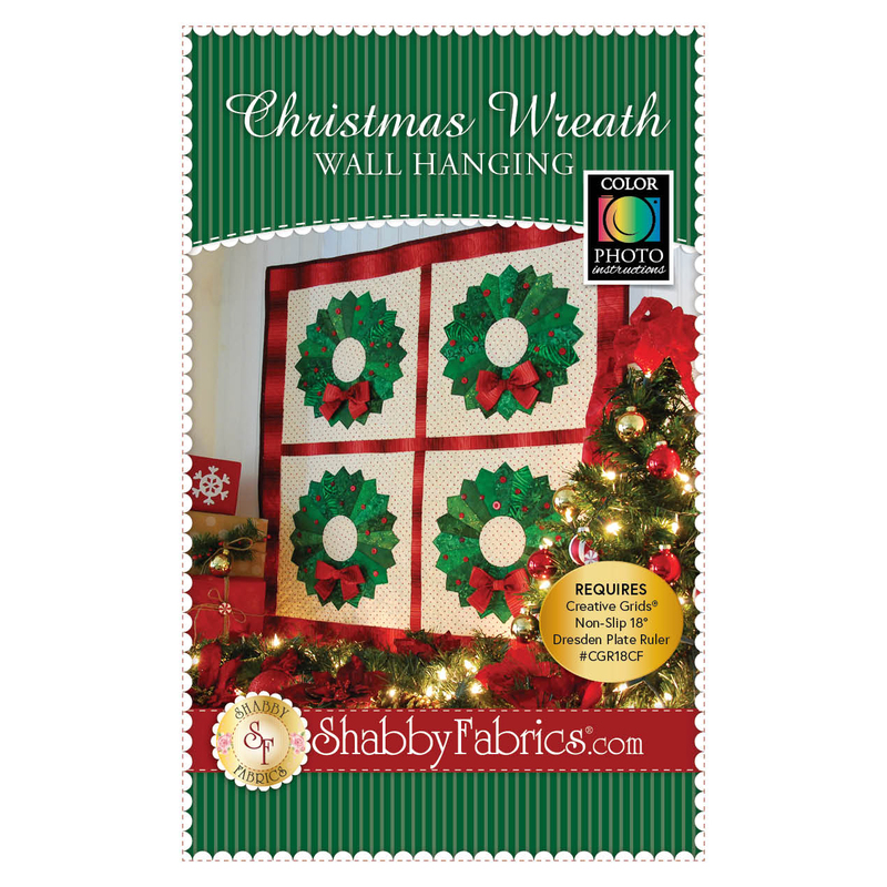 The front of the Christmas Wreath Wall Hanging pattern by Shabby Fabrics showing the finished wall hanging.