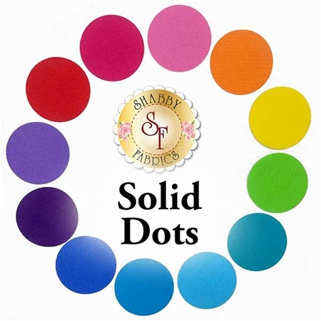 12 circle applique shapes in a rainbow of solid fabrics.
