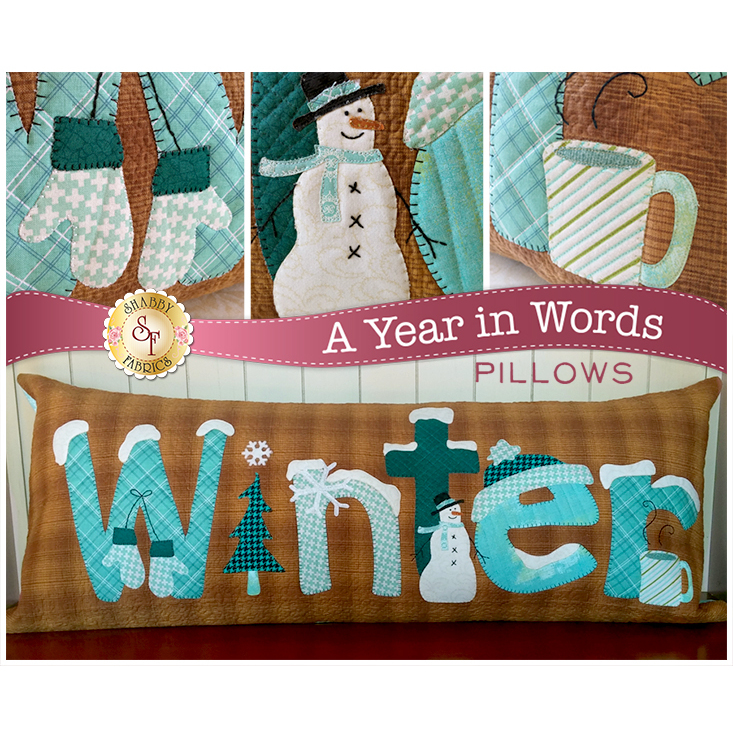 Kit for January A Year In Words pillow reading Winter with snowmen and blue mittens on brown.