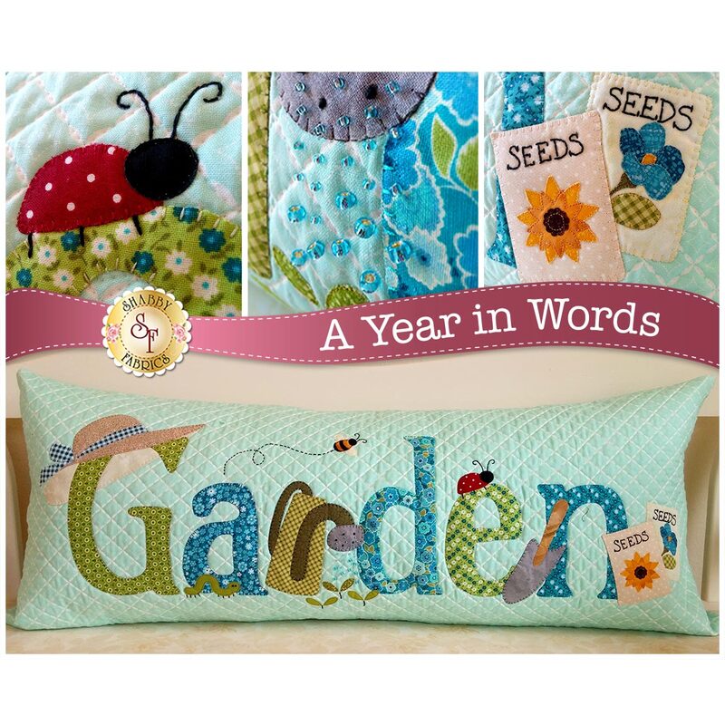 Kit for June A Year In Words pillow reading Garden with gardening tools on blue fabric.