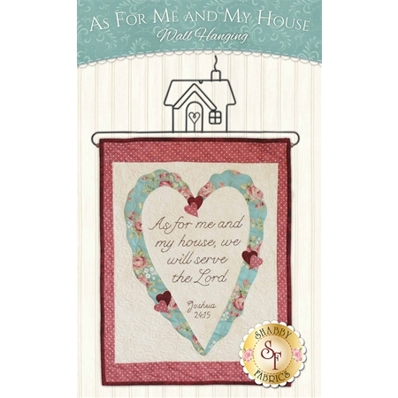 The pattern cover showing a central blue heart shape on a beige background with a rose colored outer border and quote interior.
