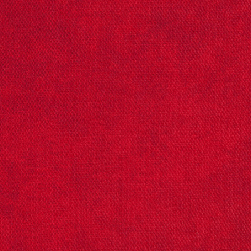 Swatch of mottled medium red fabric