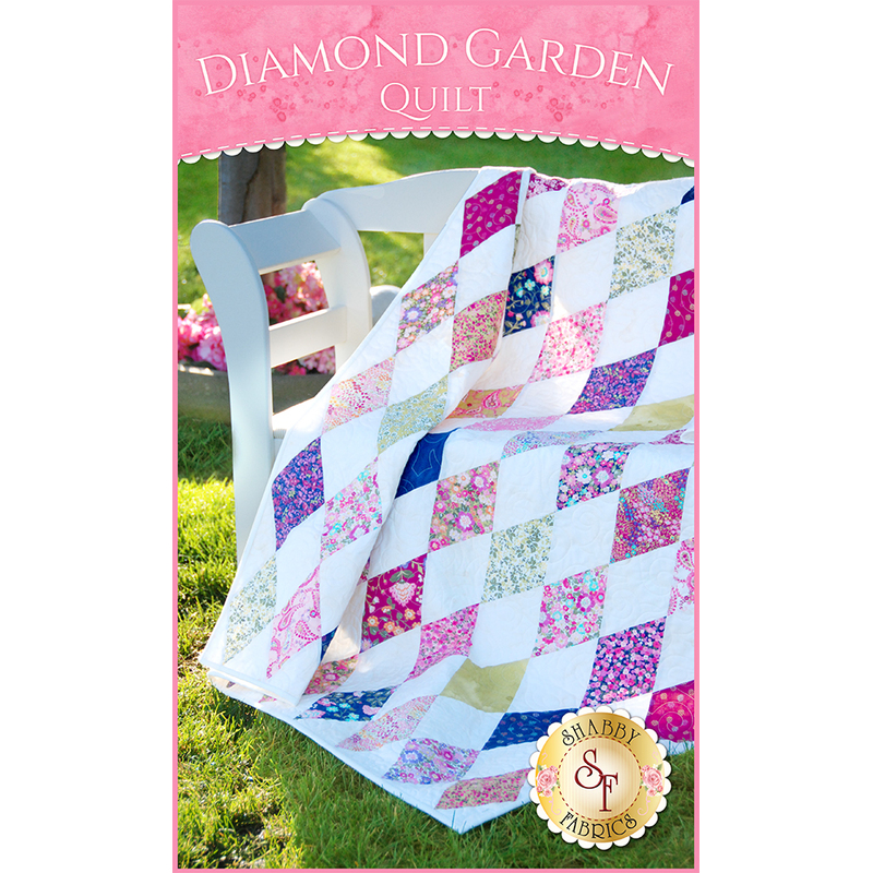 Pink, purple, and blue rhombuses on white fabric.